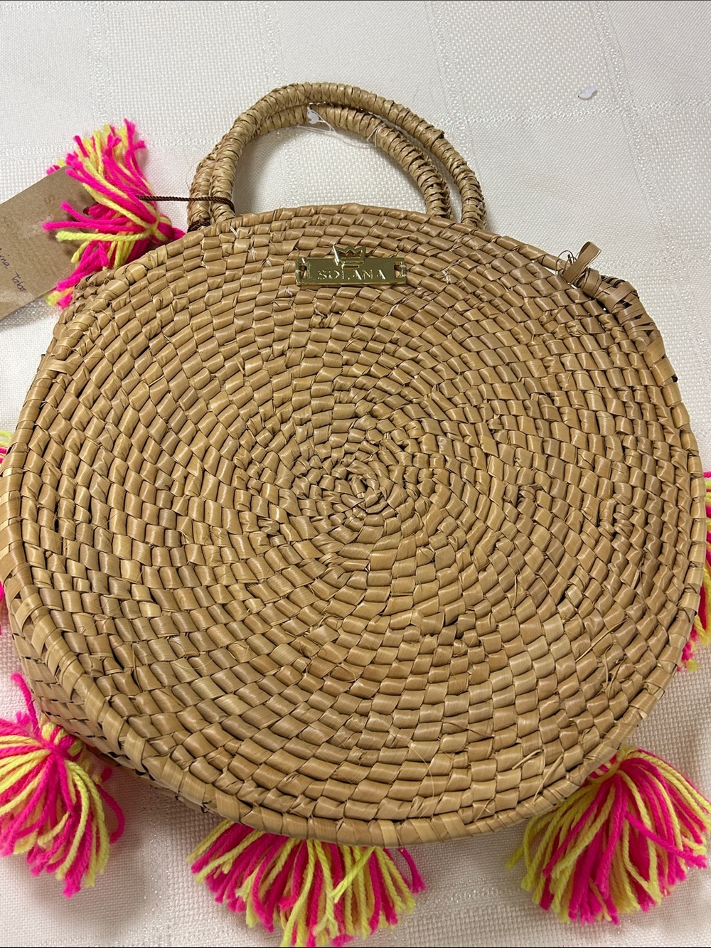 Solana Round woven Straw Tote with Hot Pink & Neon Yellow Tassel Detail image 4